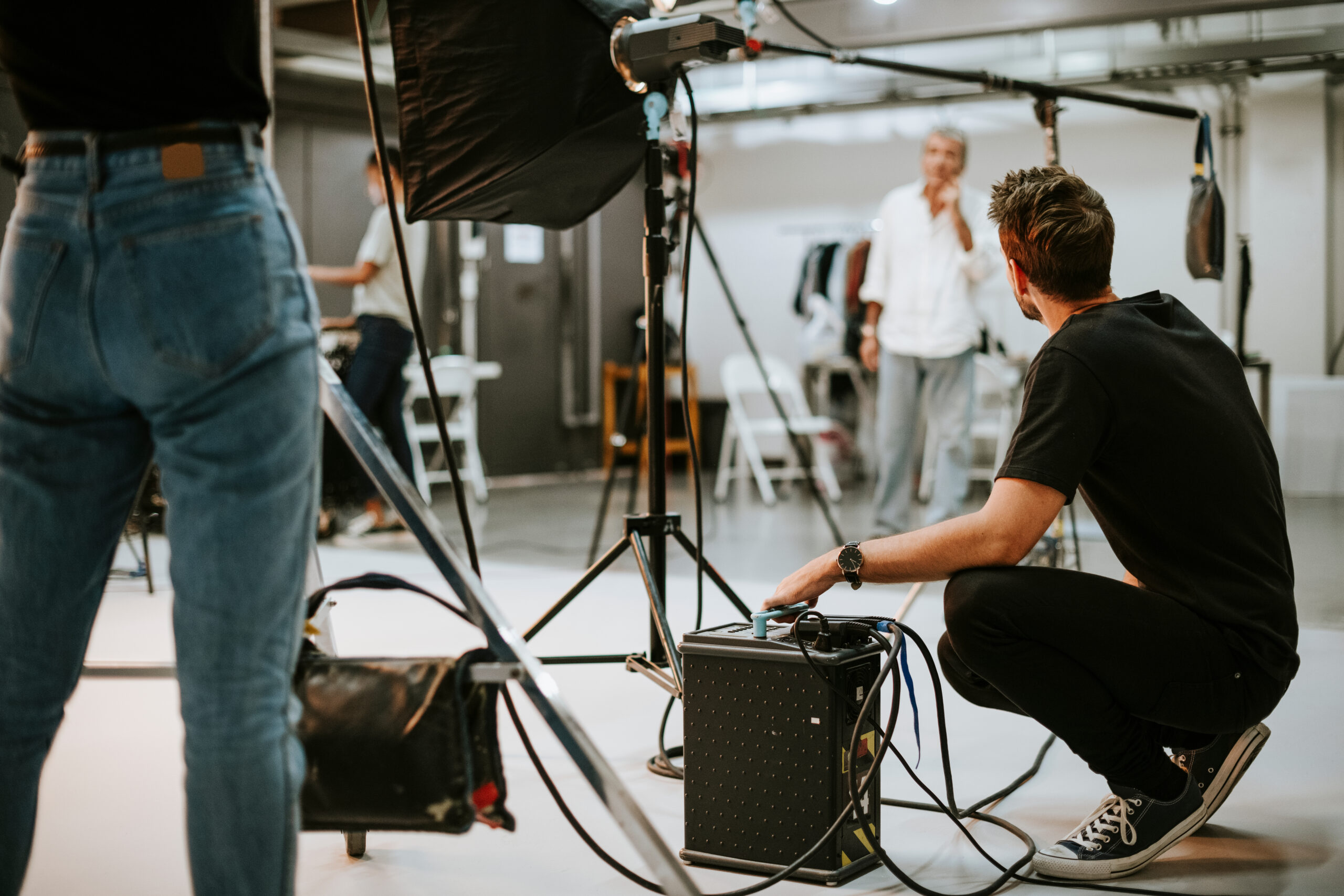 Young,Man,With,A,Battery,Pack,In,A,Studio